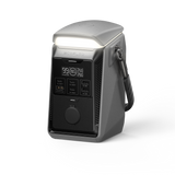 Portable power station with digital display, USB ports, and top LED light, isolated on white